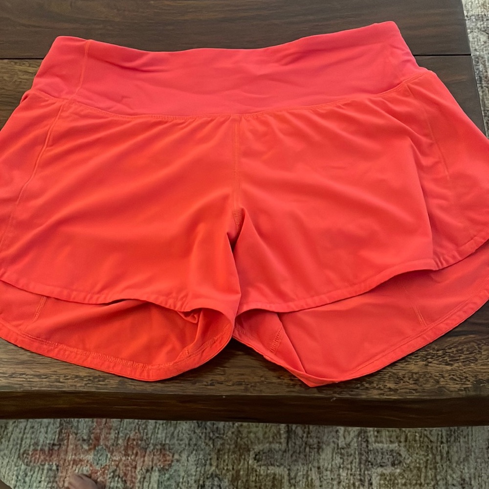 Lulu lemon shorts. Size 6 4 inch seam. Coral color